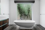 En Suite Master Bath Features Freestanding Tub